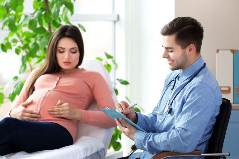 Pregnant woman with doctor at hospital Pregnant woman with doctor at hospital